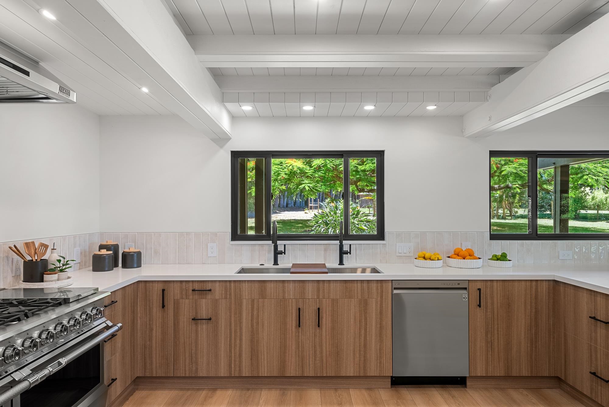 965 Hog Back Road Haiku, HI 96708 - Photo 9 of 44 a kitchen with stainless steel appliances a sink stove and window