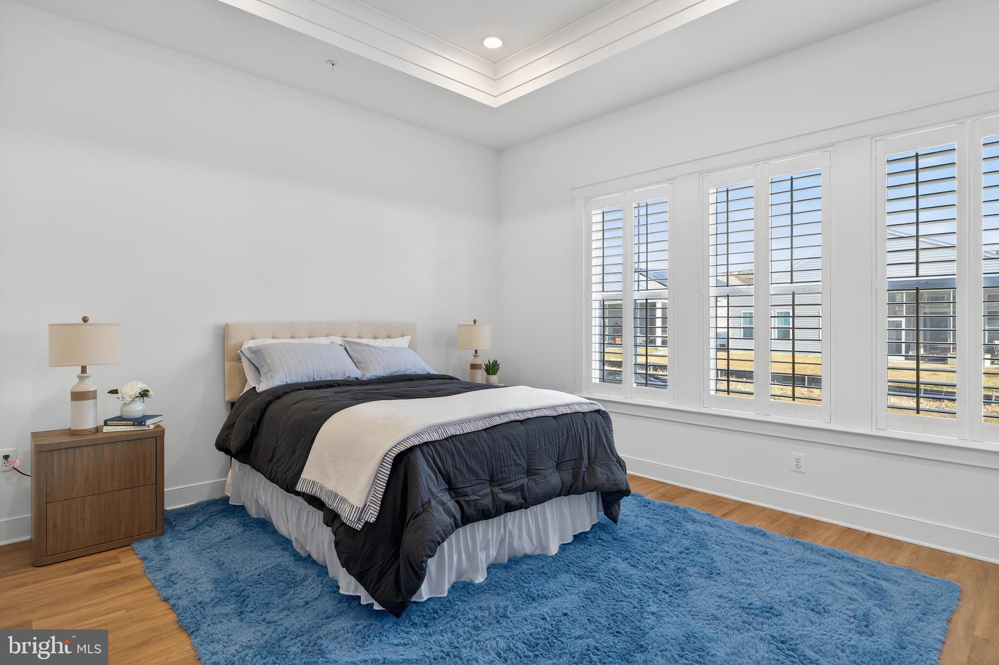 528 Warbler Way Chester, MD 21619 - Photo 12 of 29 a spacious bedroom with a bed and a large window