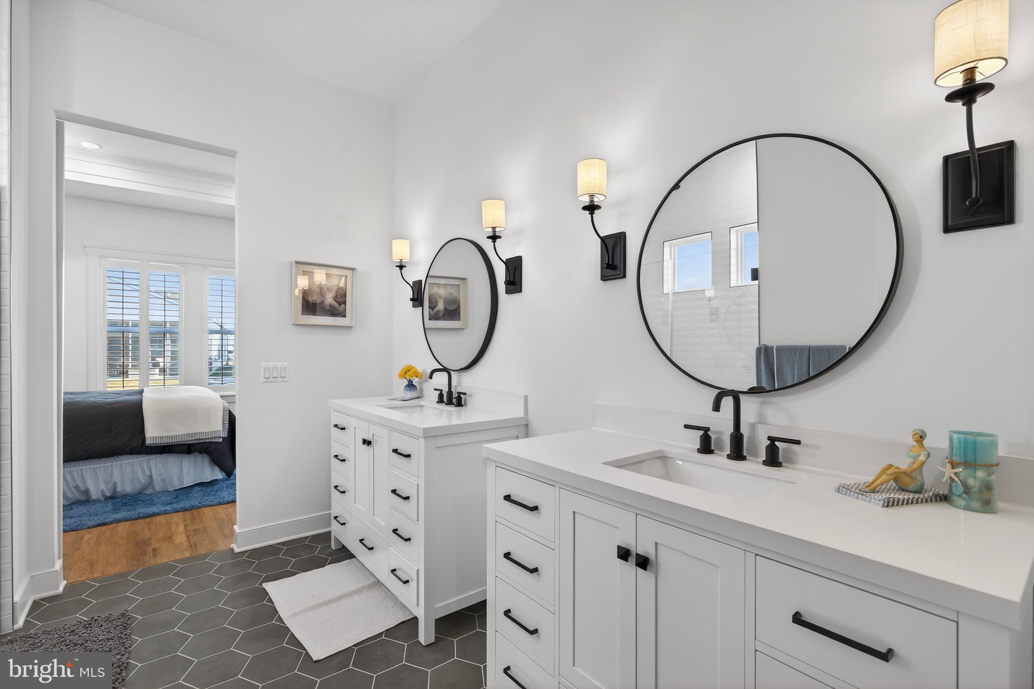 528 Warbler Way Chester, MD 21619 - Photo 16 of 29 a en suite bathroom with a double vanity sink and a mirror