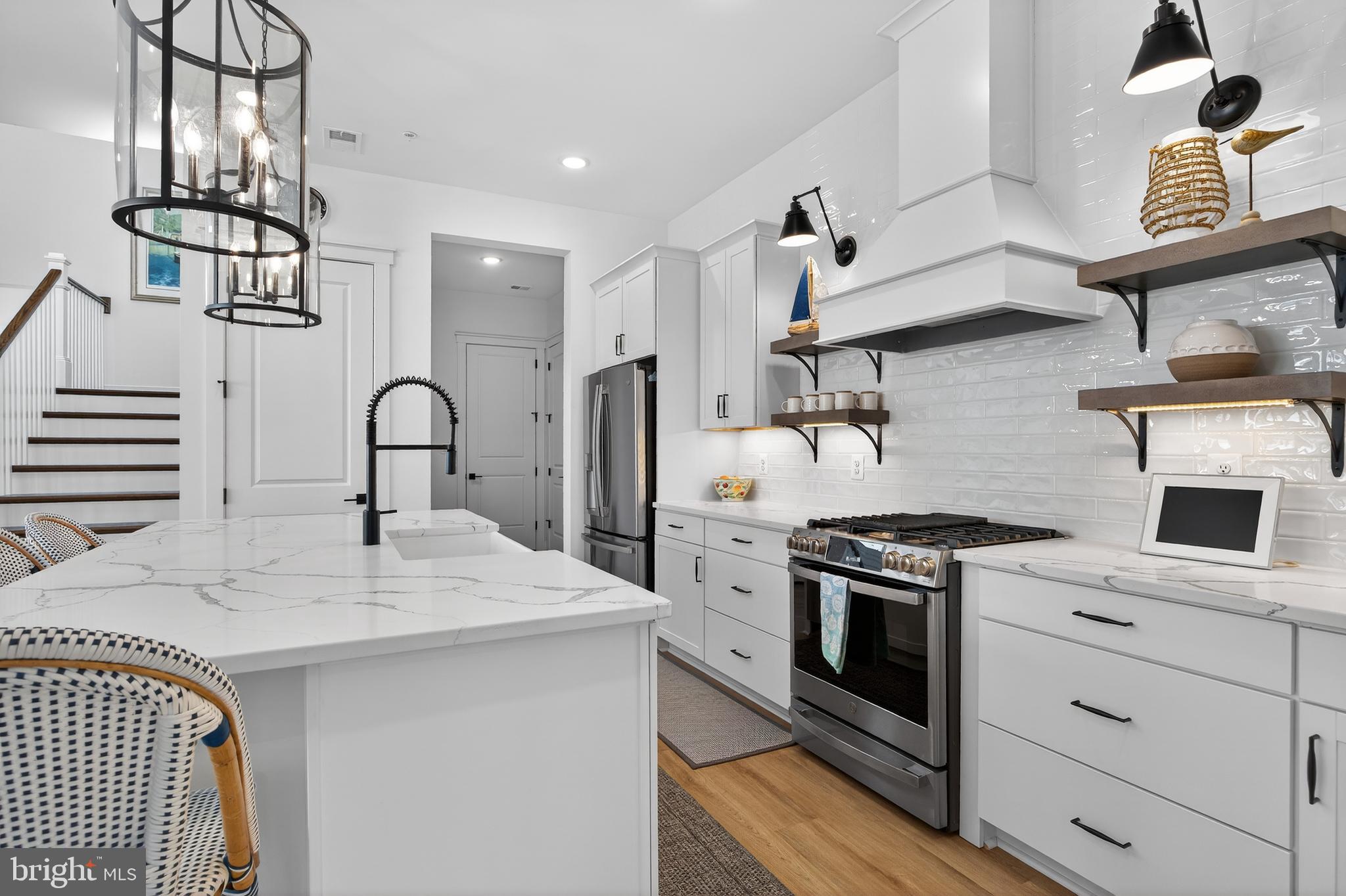 528 Warbler Way Chester, MD 21619 - Photo 7 of 29 a kitchen with a sink stainless steel appliances and cabinets