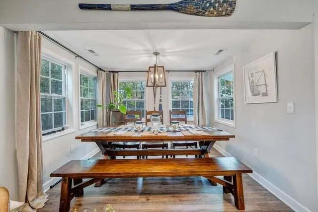 a kitchen with stainless steel appliances a stove a sink a microwave a refrigerator and cabinets