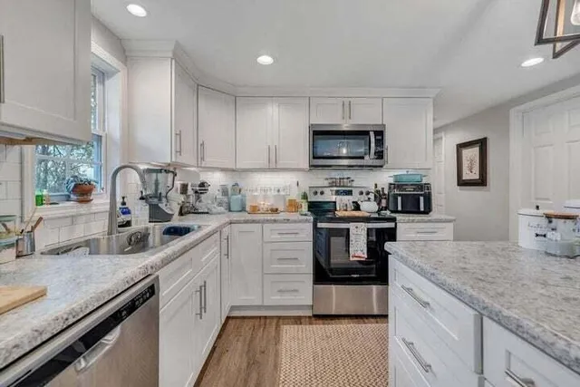 a bedroom with a bed and a table in it