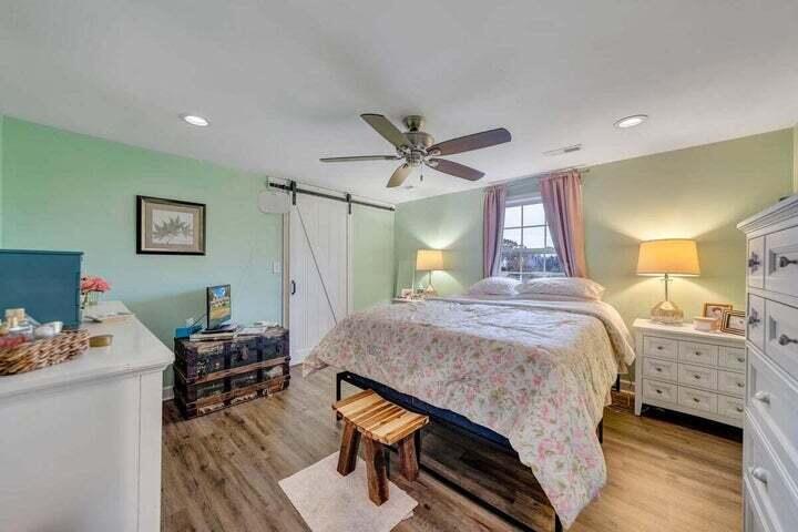 945 Burnt Chimney Road Wirtz, VA 24184 - Photo 17 of 54 a bedroom with a bed and a table in it