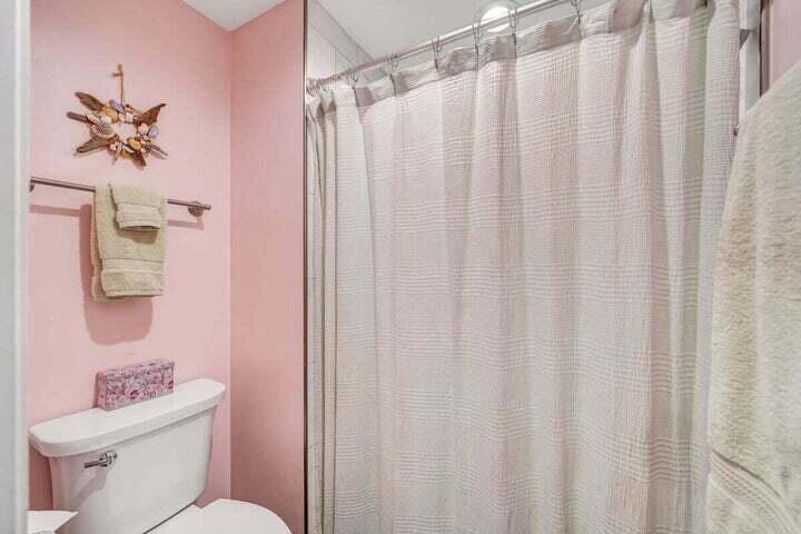 945 Burnt Chimney Road Wirtz, VA 24184 - Photo 20 of 54 a white toilet sitting next to a shower curtain