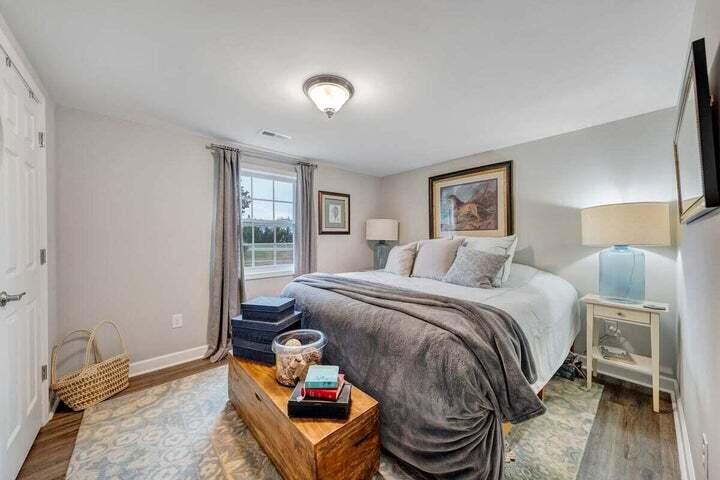 945 Burnt Chimney Road Wirtz, VA 24184 - Photo 22 of 54 a bedroom with a bed and wooden floor