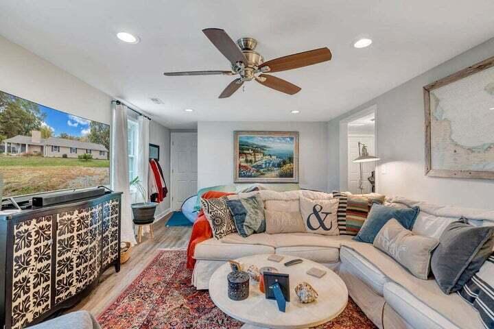 945 Burnt Chimney Road Wirtz, VA 24184 - Photo 25 of 54 a living room with furniture and a flat screen tv