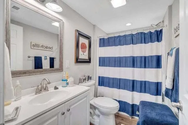 a view of a room with lots of furniture and chandelier