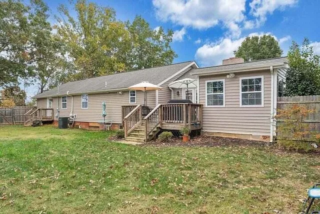 a view of outdoor space with deck and yard