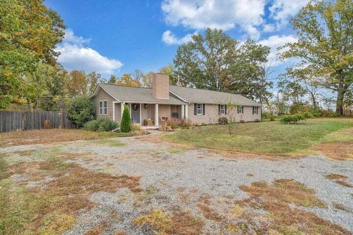 945 Burnt Chimney Road Wirtz, VA 24184 - Photo 48 of 54 a front view of a house with a yard