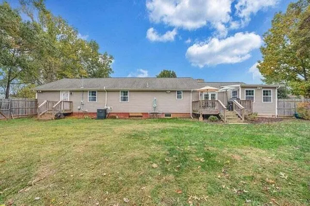 a house with trees in the background