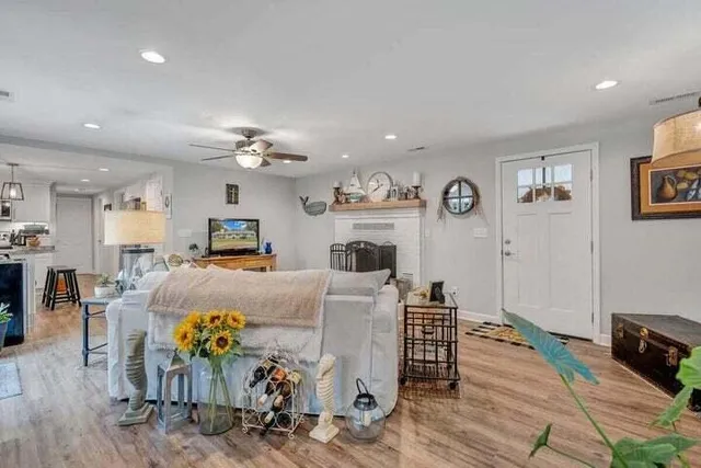 a living room with furniture and a fireplace