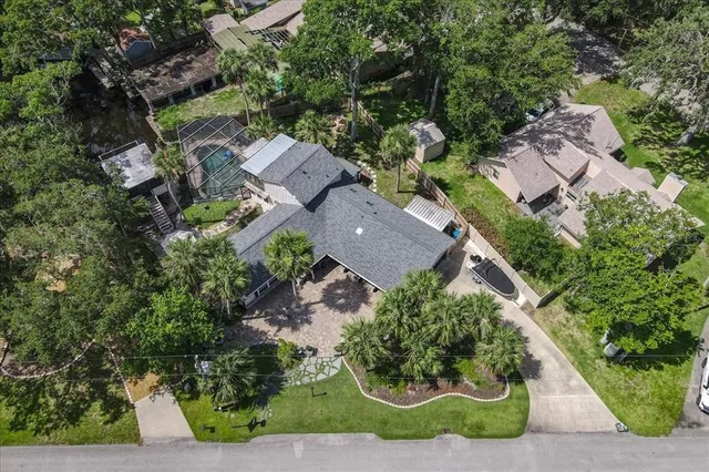 an aerial view of residential house with outdoor space