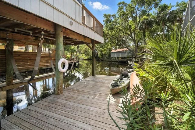 a large kitchen with stainless steel appliances granite countertop a refrigerator and a stove