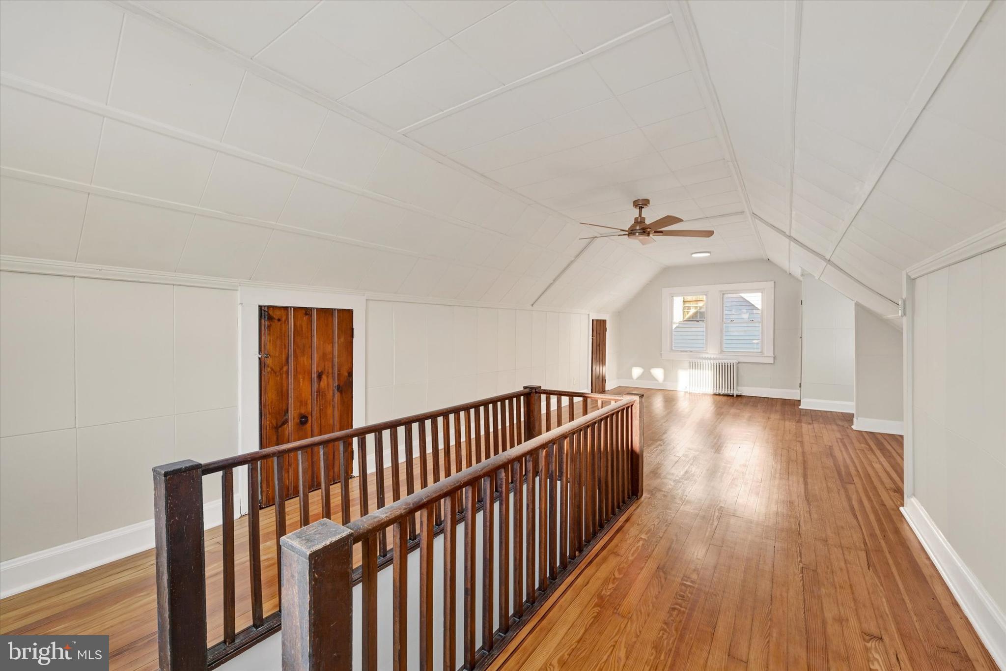 1032 Elm Ridge Avenue Baltimore, MD 21229 - Photo 18 of 28 a view of a hallway with wooden floor and stairs