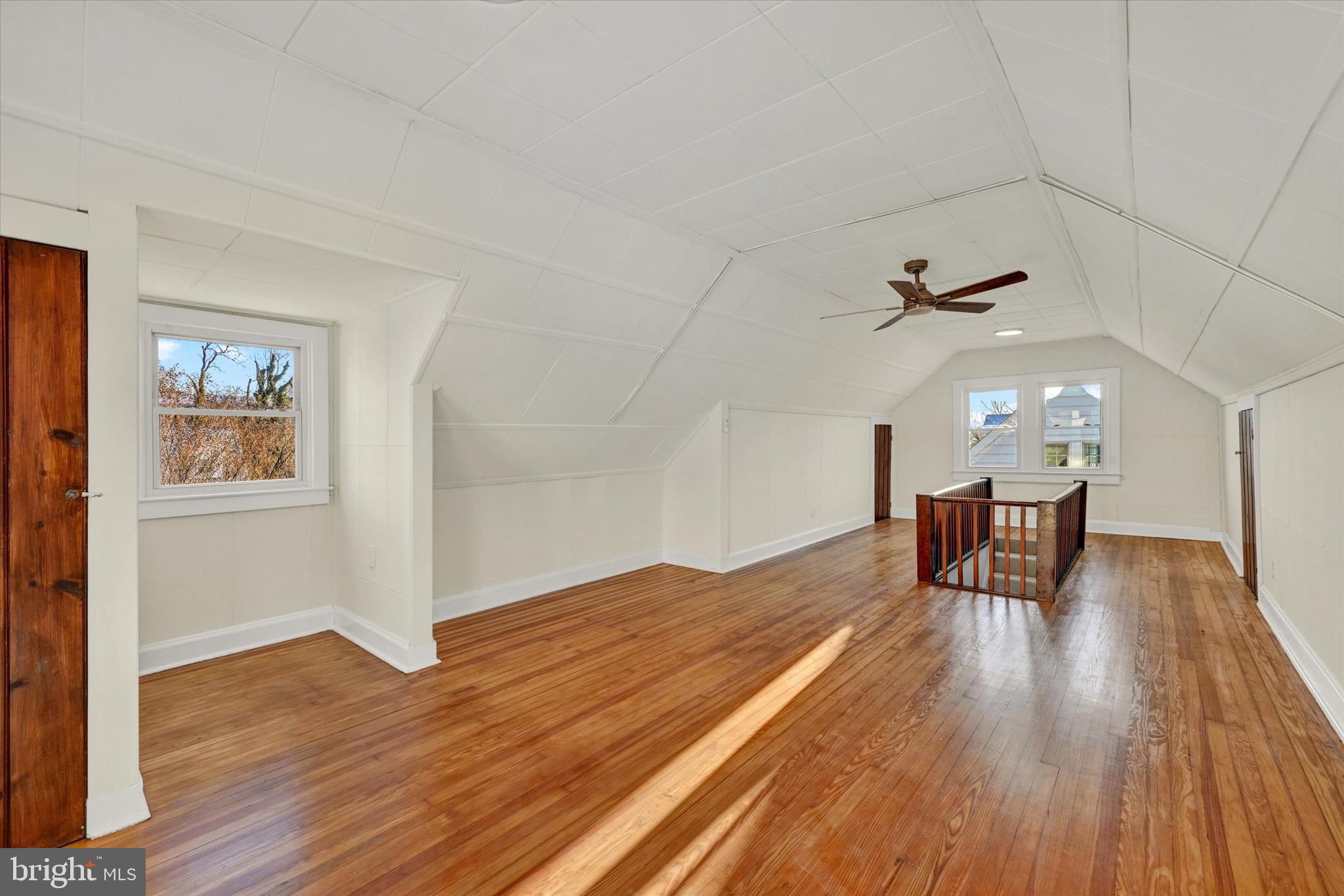 1032 Elm Ridge Avenue Baltimore, MD 21229 - Photo 19 of 28 a furnished livingroom with windows and wooden floor