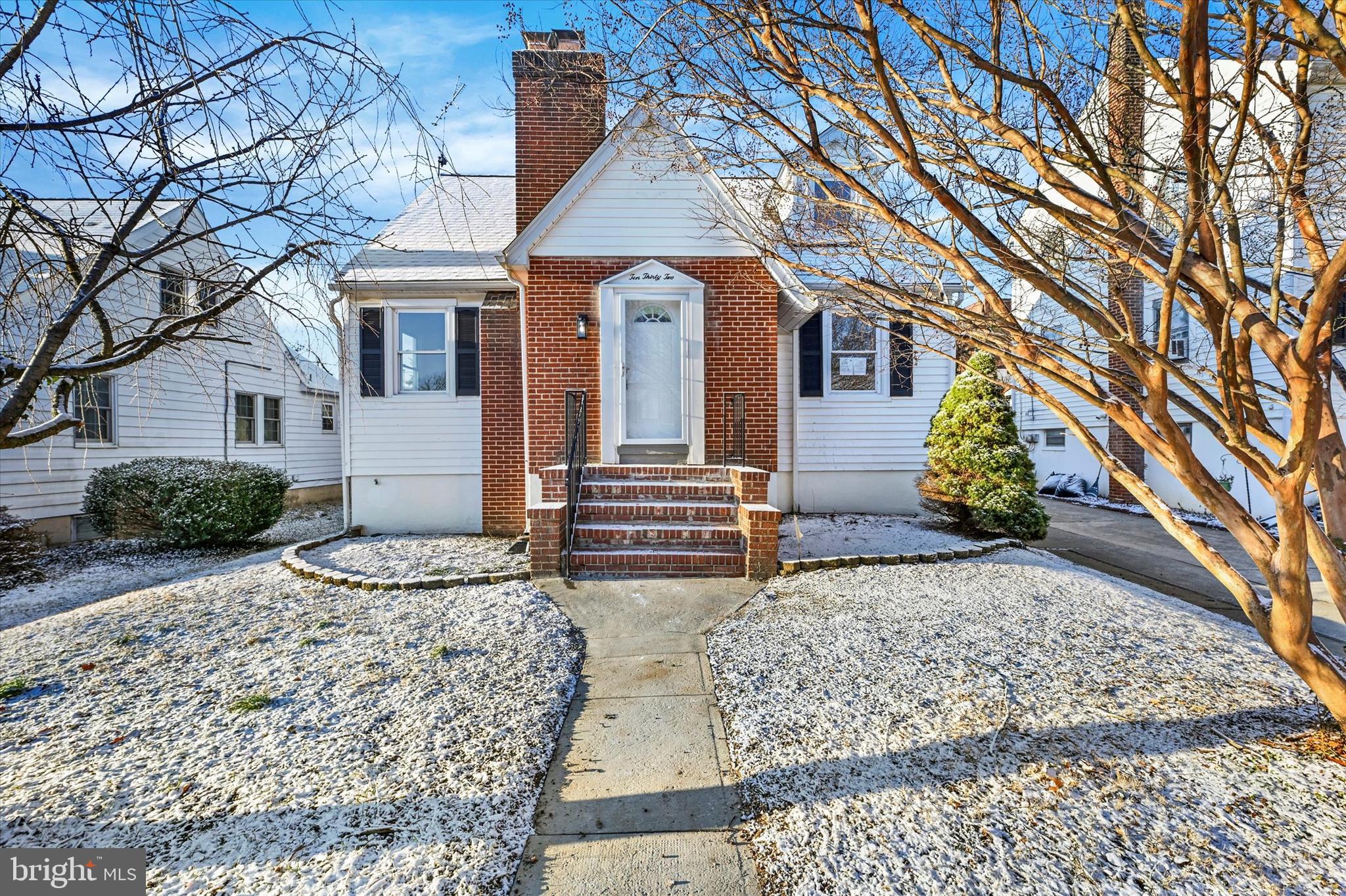 1032 Elm Ridge Avenue Baltimore, MD 21229 - Photo 2 of 28 a front view of a house with garden