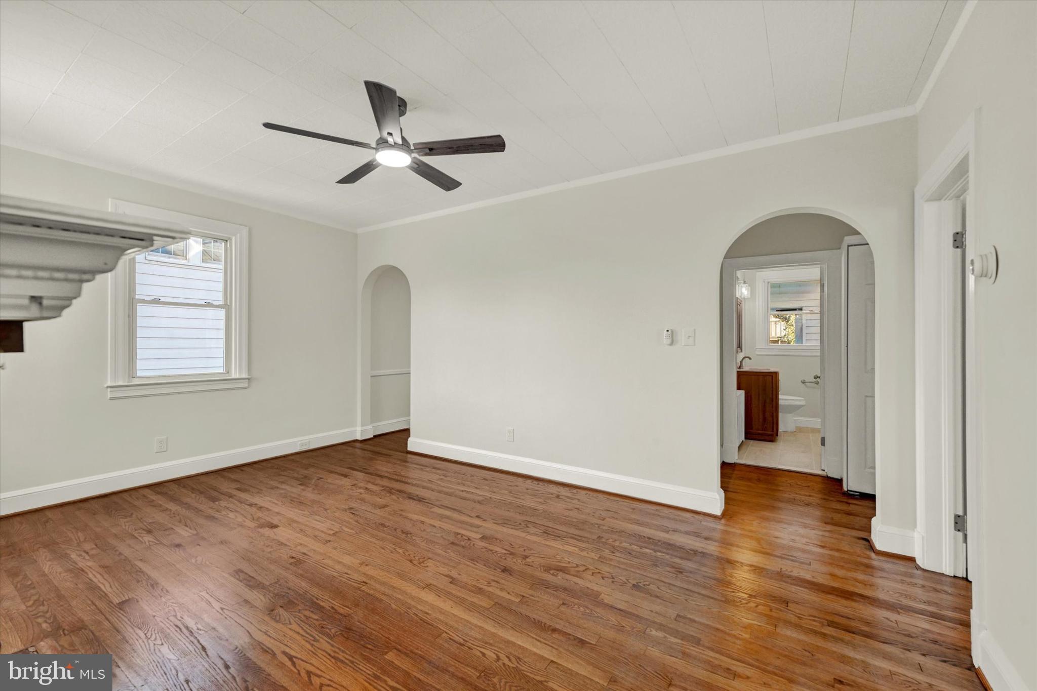 1032 Elm Ridge Avenue Baltimore, MD 21229 - Photo 4 of 28 a view of empty room with wooden floor and fan