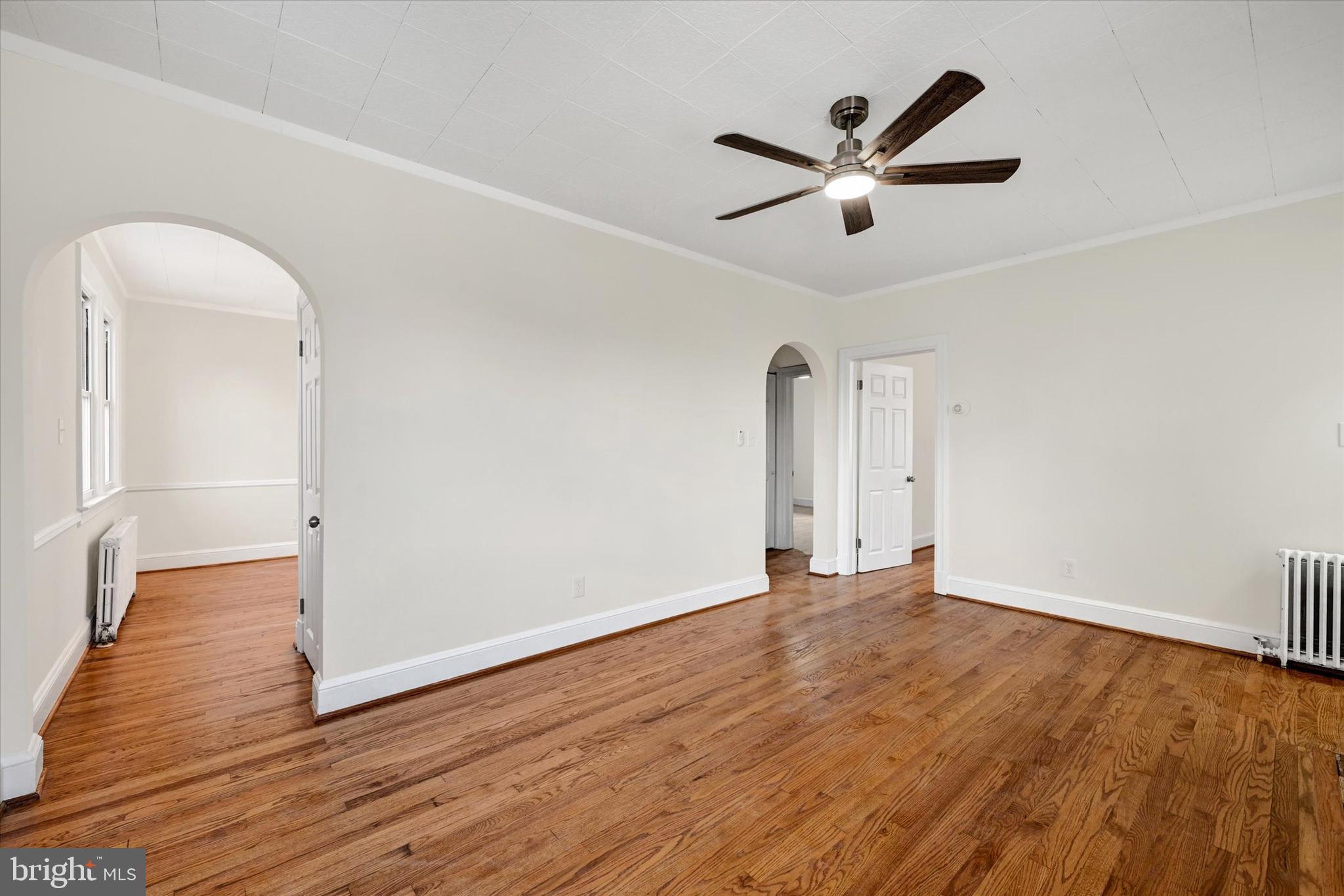 1032 Elm Ridge Avenue Baltimore, MD 21229 - Photo 7 of 28 a view of an empty room with wooden floor