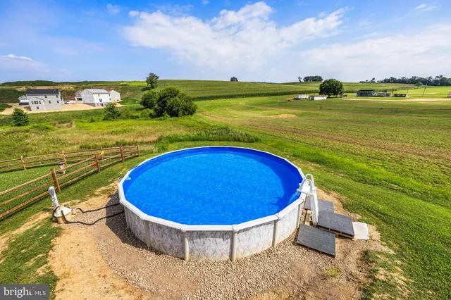 a view of a swimming pool with an ocean view