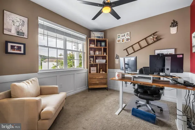 a workspace with furniture and window