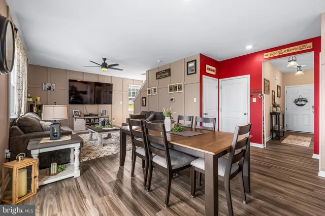 a view of a livingroom with furniture and a flat screen tv