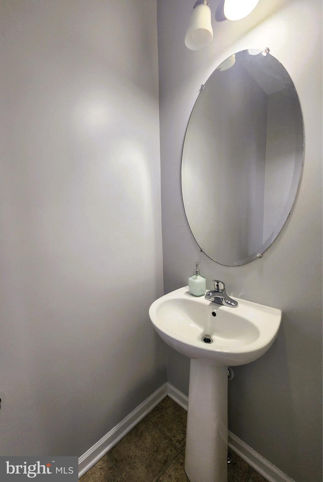 102 Mill Pond Road Frederick, MD 21701 - Photo 11 of 29 a bathroom with a sink and a mirror
