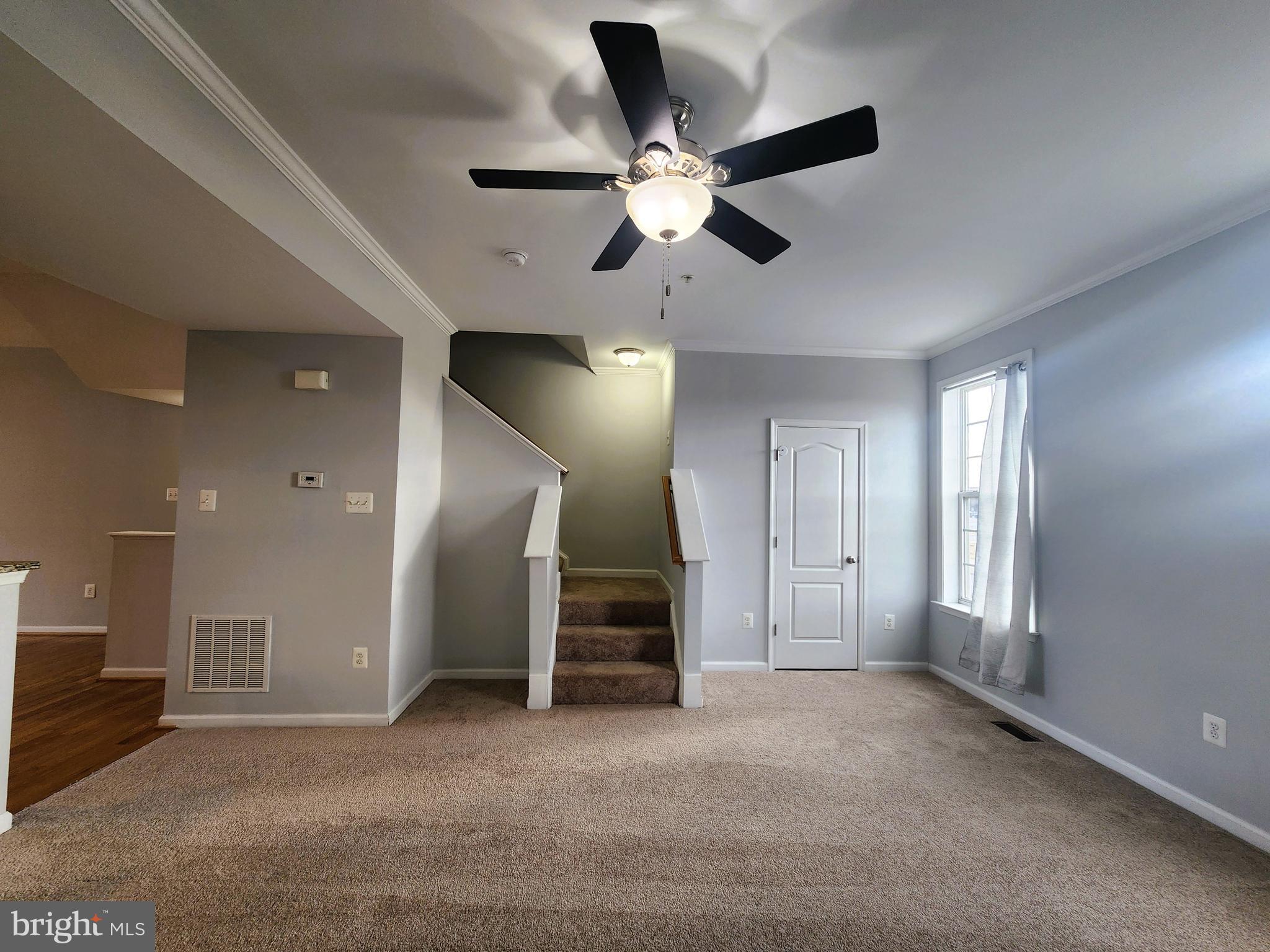 102 Mill Pond Road Frederick, MD 21701 - Photo 13 of 29 a view of a livingroom with a ceiling fan and window