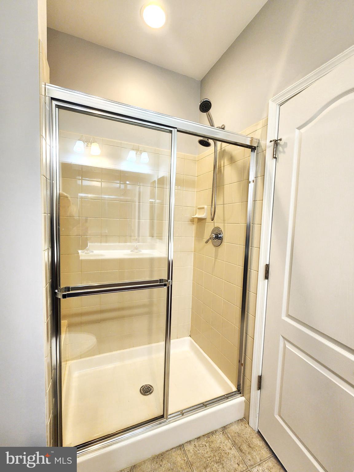 102 Mill Pond Road Frederick, MD 21701 - Photo 20 of 29 a bathroom with a glass shower door