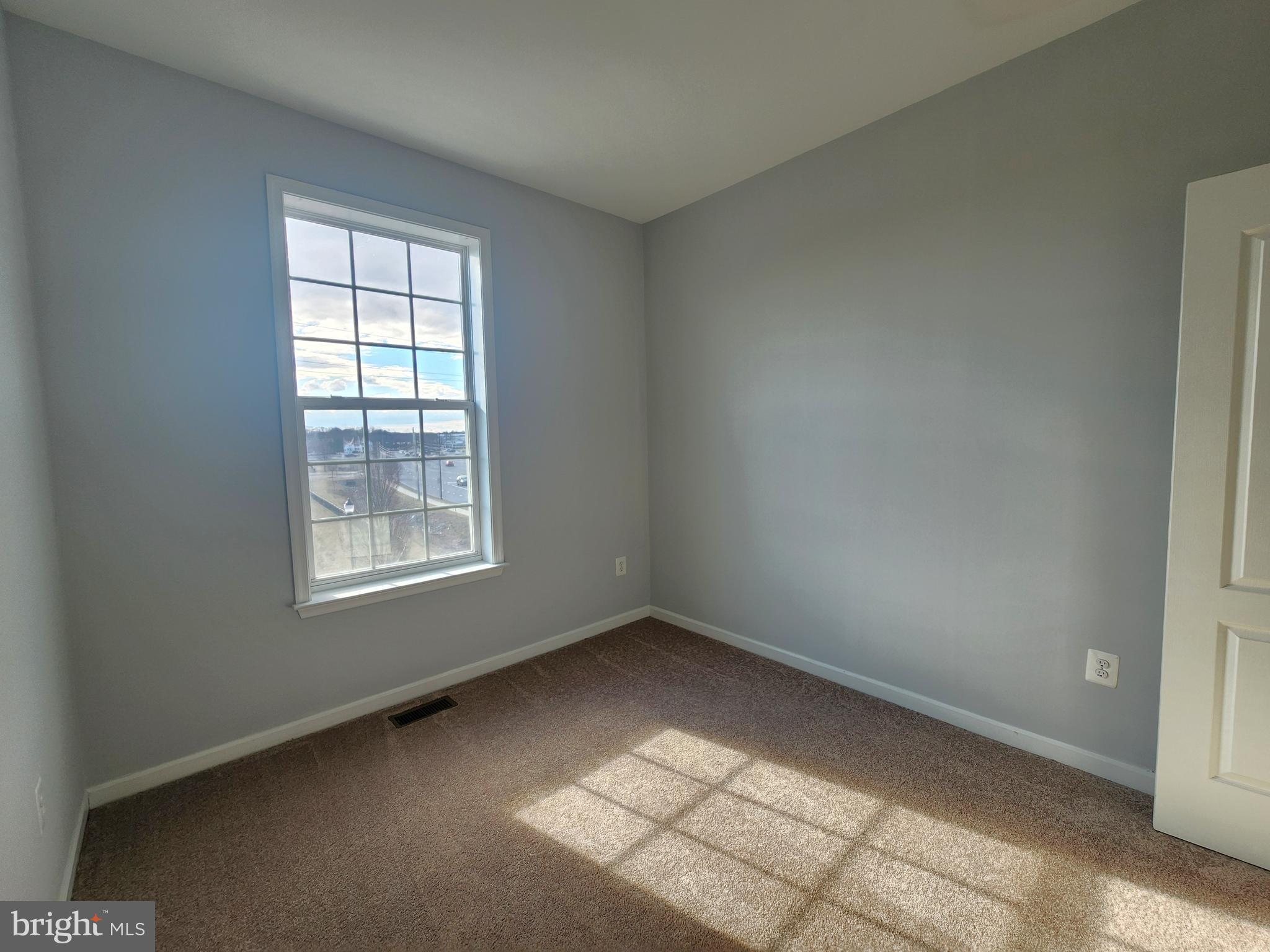 102 Mill Pond Road Frederick, MD 21701 - Photo 22 of 29 an empty room with a window