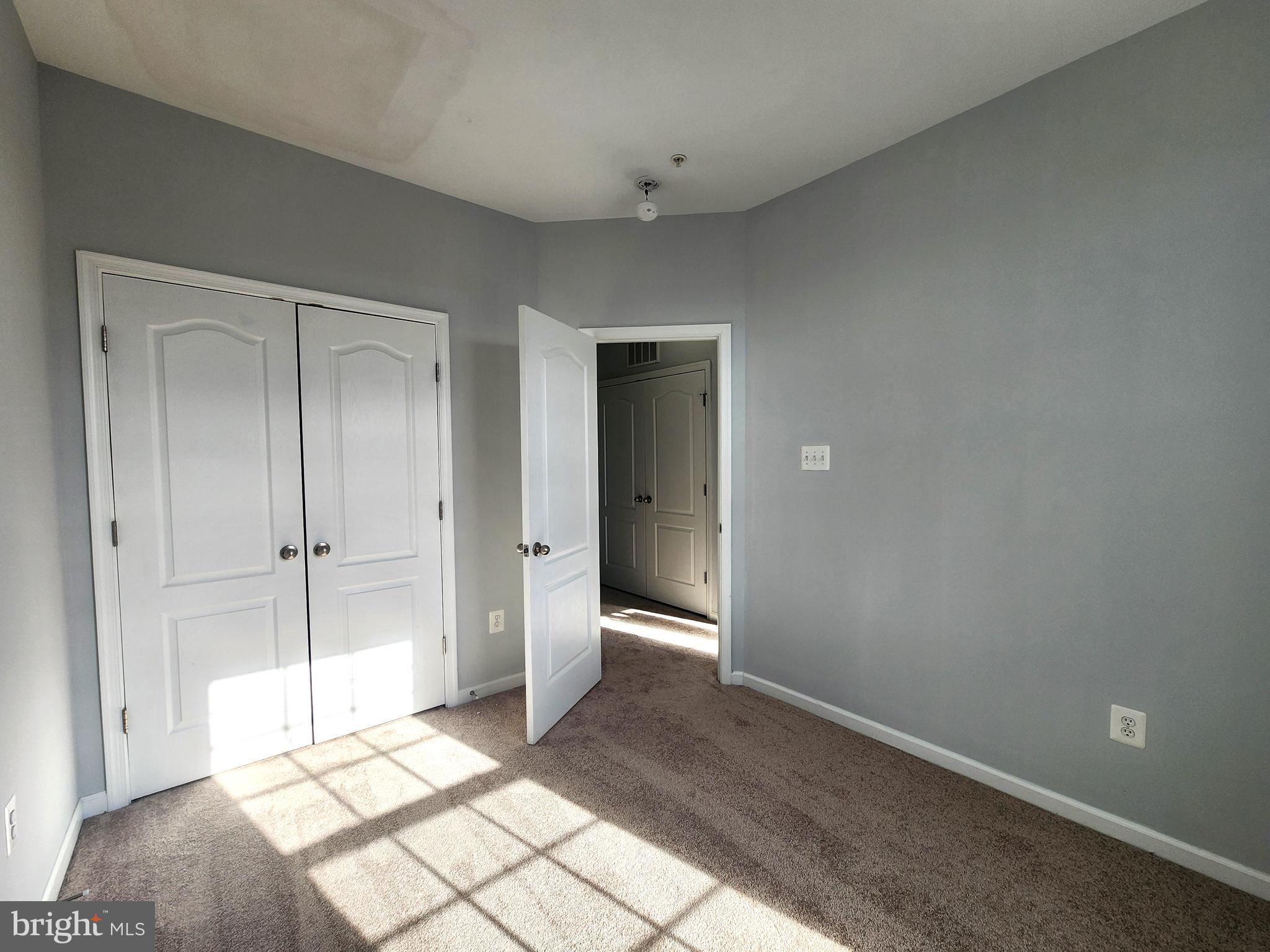 102 Mill Pond Road Frederick, MD 21701 - Photo 23 of 29 a view of a big room with closet and wooden floor