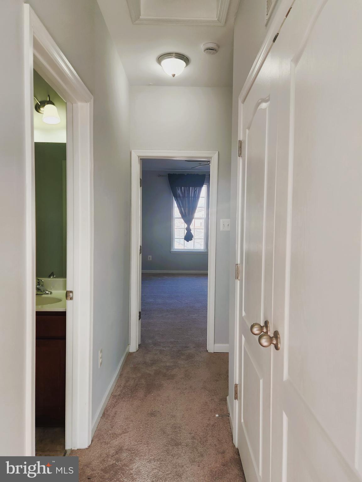 102 Mill Pond Road Frederick, MD 21701 - Photo 25 of 29 a view of a hallway with wooden floor