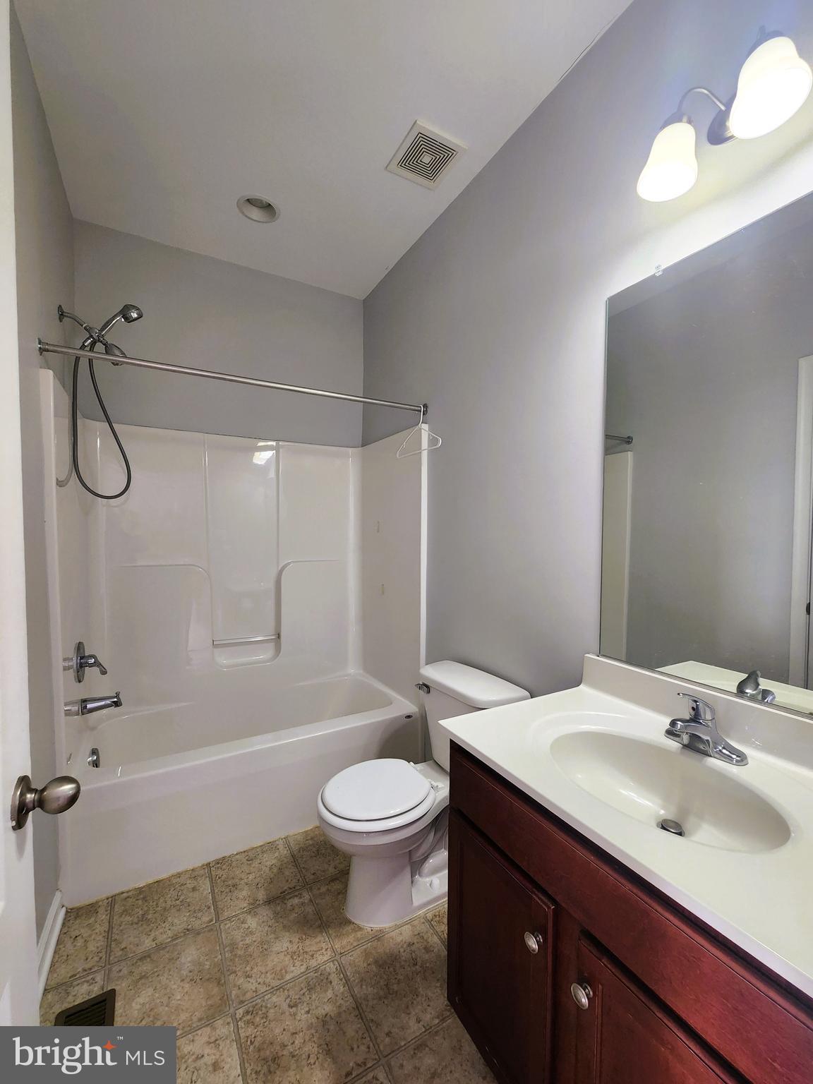 102 Mill Pond Road Frederick, MD 21701 - Photo 27 of 29 a bathroom with a sink a toilet and shower