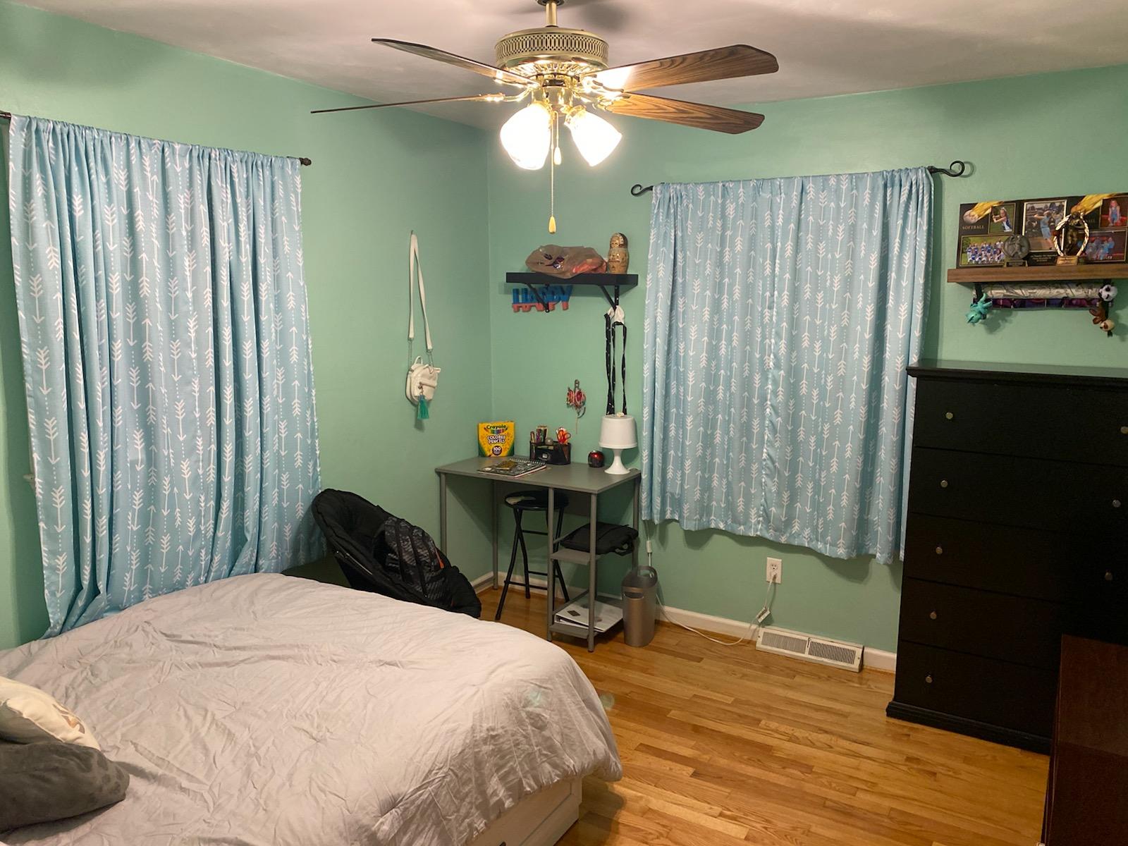 601 Olney Road Vinton, VA 24179 - Photo 12 of 18 a bedroom with a bed and a chandelier