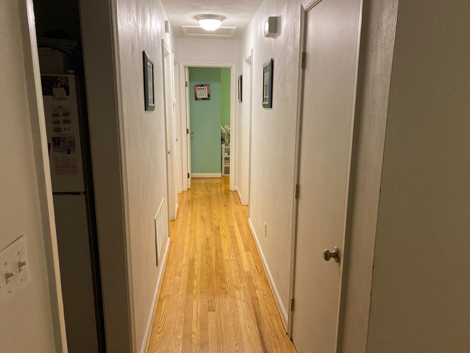 601 Olney Road Vinton, VA 24179 - Photo 6 of 18 a view of a hallway with wooden floor