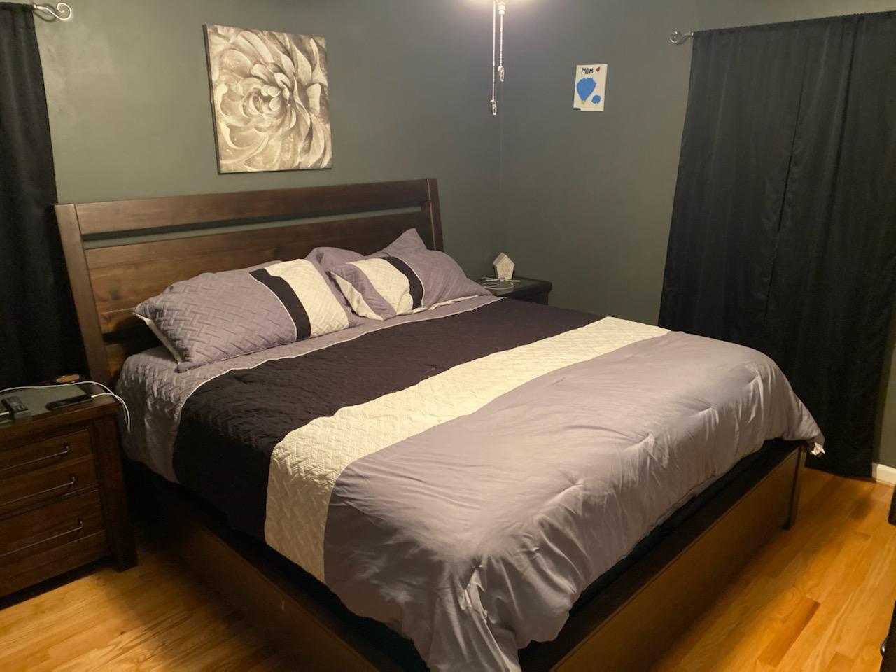 601 Olney Road Vinton, VA 24179 - Photo 7 of 18 a bedroom with a bed and painting on the wall