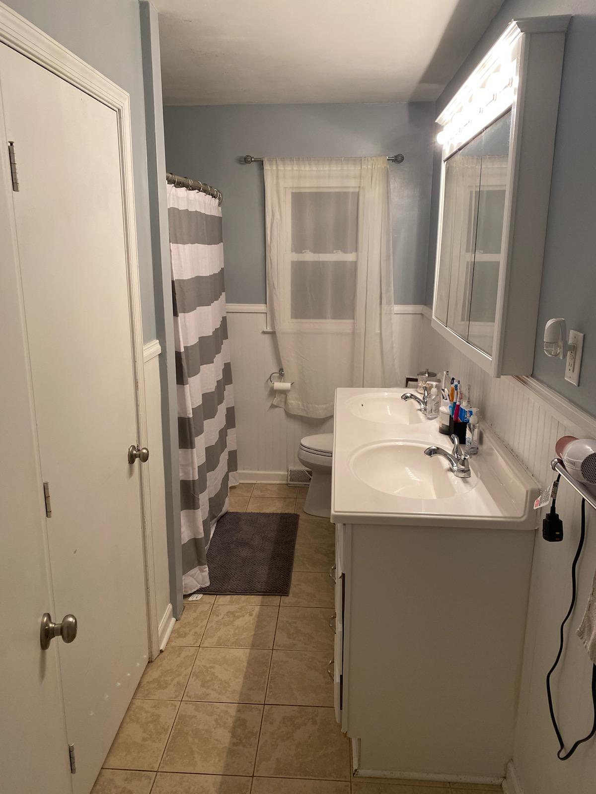 601 Olney Road Vinton, VA 24179 - Photo 9 of 18 a bathroom with a sink toilet and shower