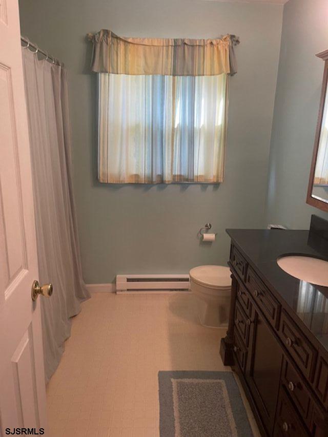 1431 Stagecoach Road Ocean View, NJ 08230 - Photo 7 of 11 a bathroom with a sink a toilet and tub