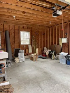 a front view of a house with a yard and a garden