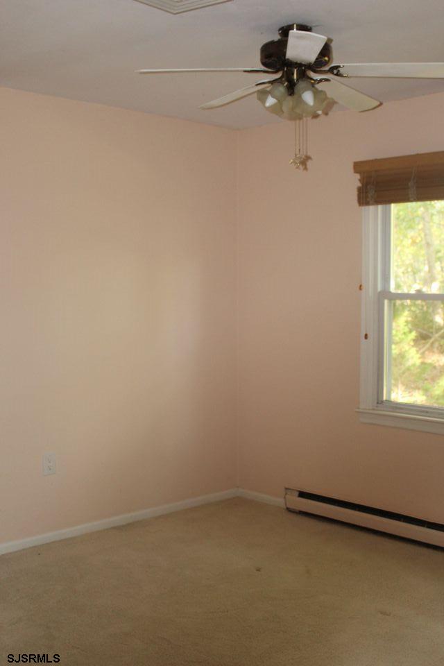 1431 Stagecoach Road Ocean View, NJ 08230 - Photo 9 of 11 an empty room with a window