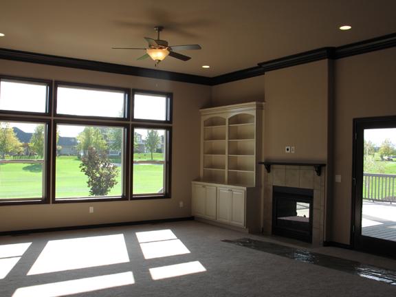 8970 Coolidge Road, Unit 6 Yakima, WA 98903 - Photo 2 of 15 a view of an empty room with a fireplace and a window