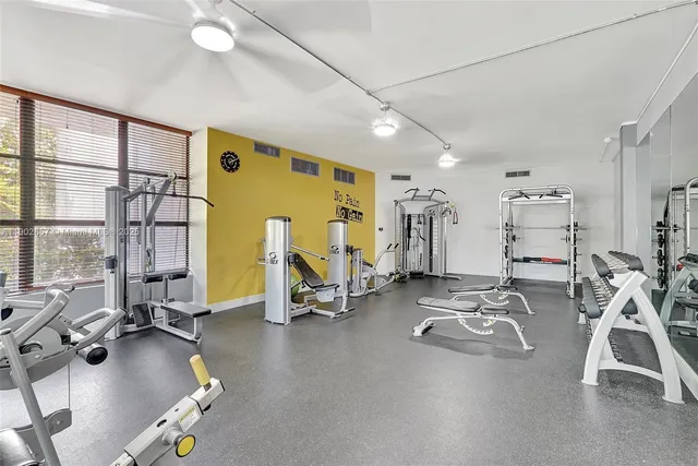 a view of swimming pool with outdoor seating and plants