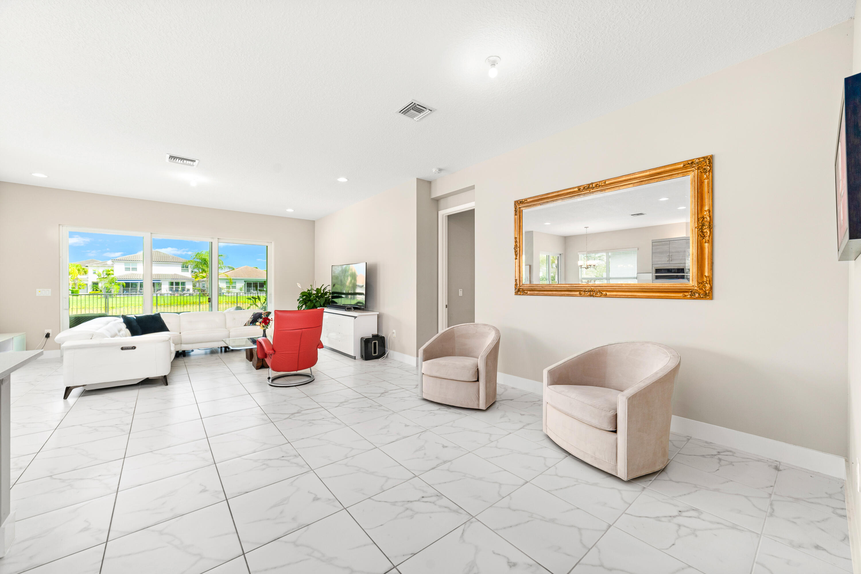 15380 Blue River Road Delray Beach, FL 33446 - Photo 11 of 31 a living room with furniture and a potted plant