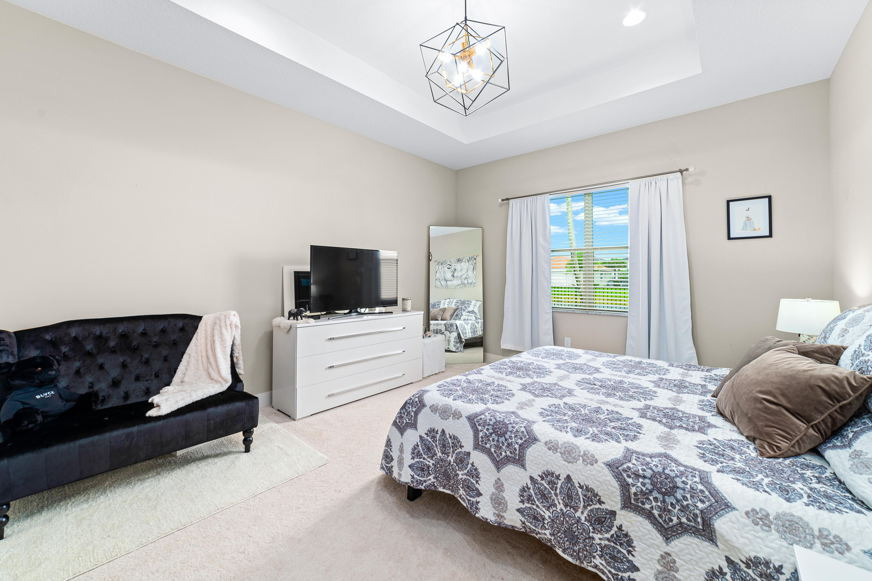 15380 Blue River Road Delray Beach, FL 33446 - Photo 13 of 31 a bedroom with a bed and flat screen tv