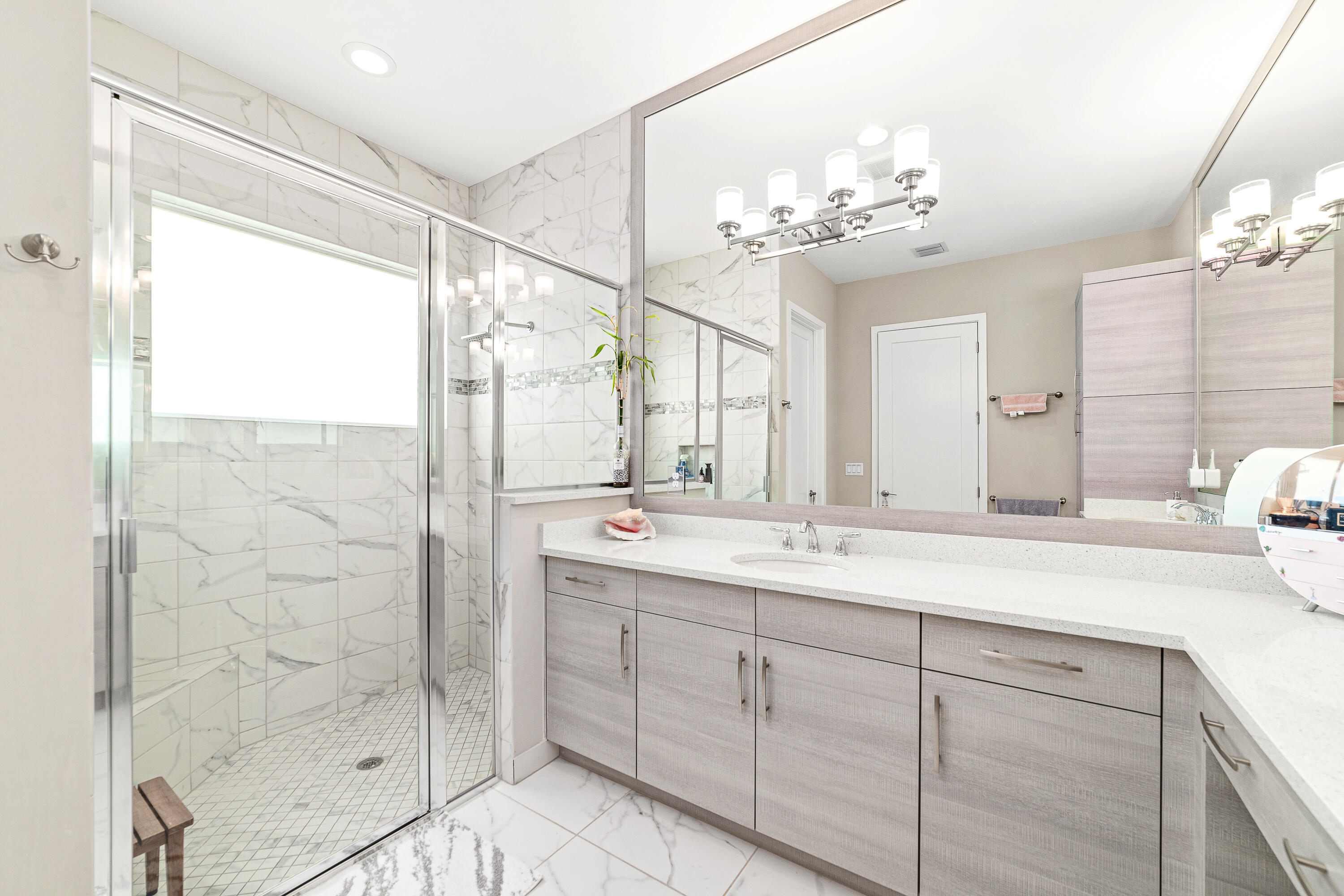 15380 Blue River Road Delray Beach, FL 33446 - Photo 15 of 31 a bathroom with a double vanity sink mirror and shower