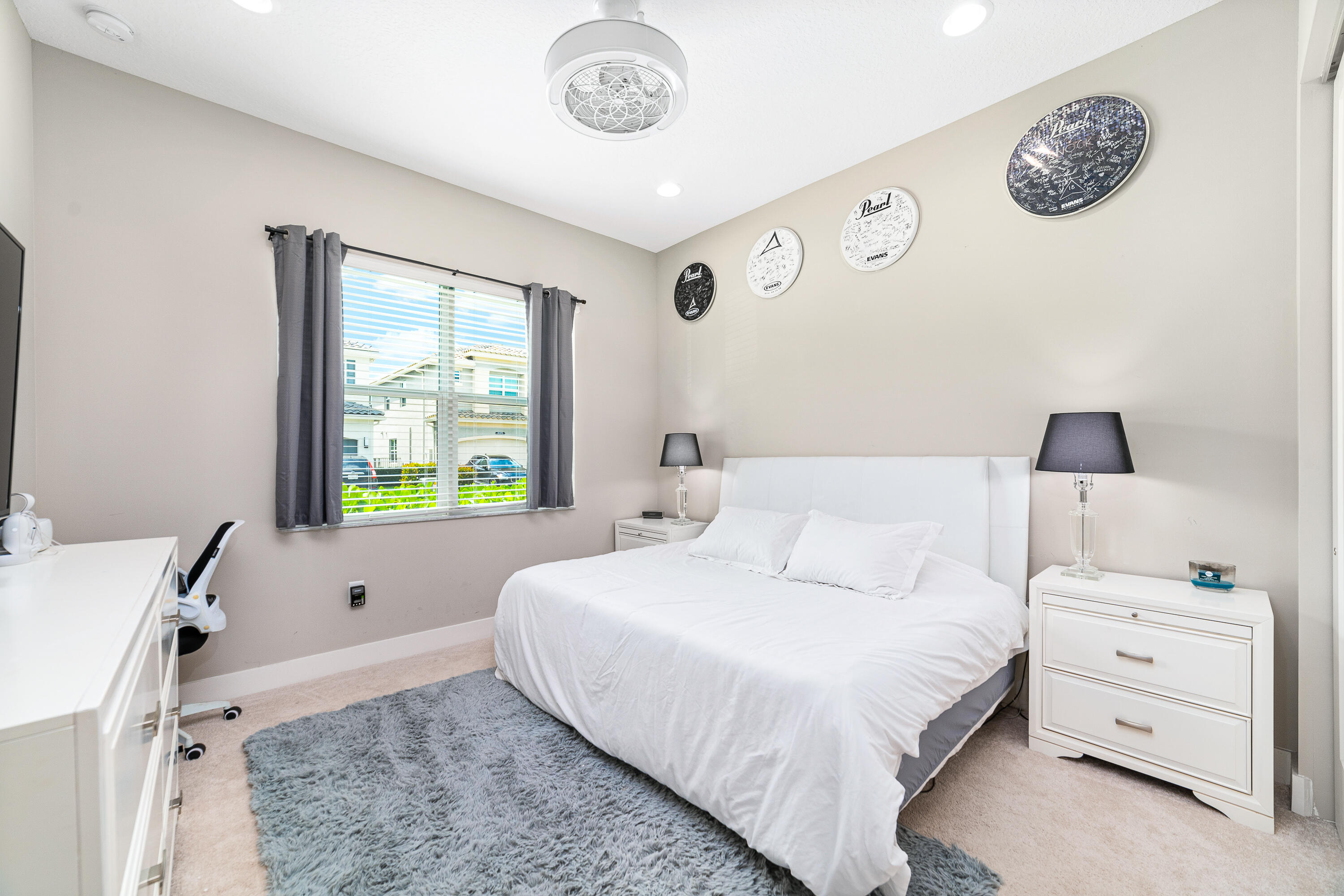 15380 Blue River Road Delray Beach, FL 33446 - Photo 17 of 31 a bedroom with a bed and a window