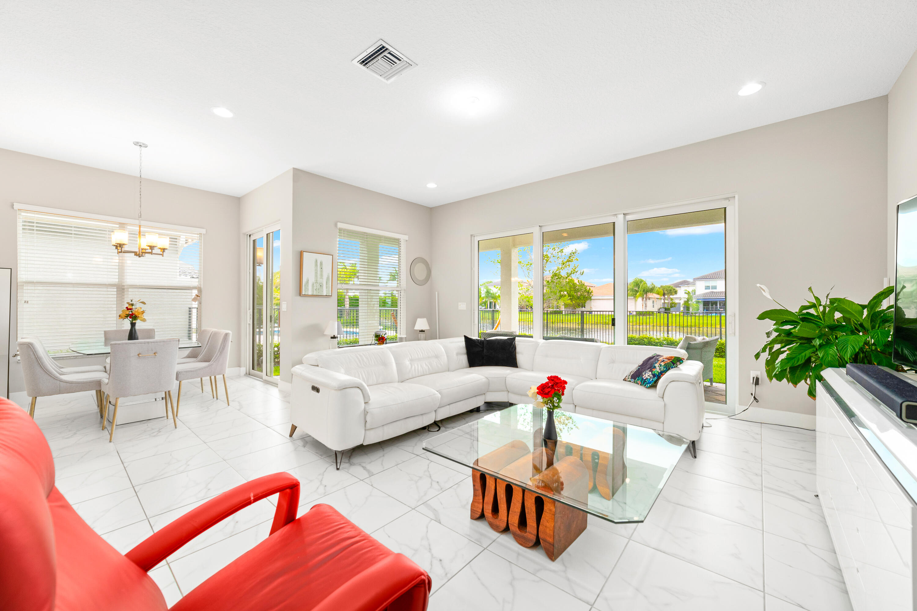15380 Blue River Road Delray Beach, FL 33446 - Photo 2 of 31 a living room with furniture and a large window
