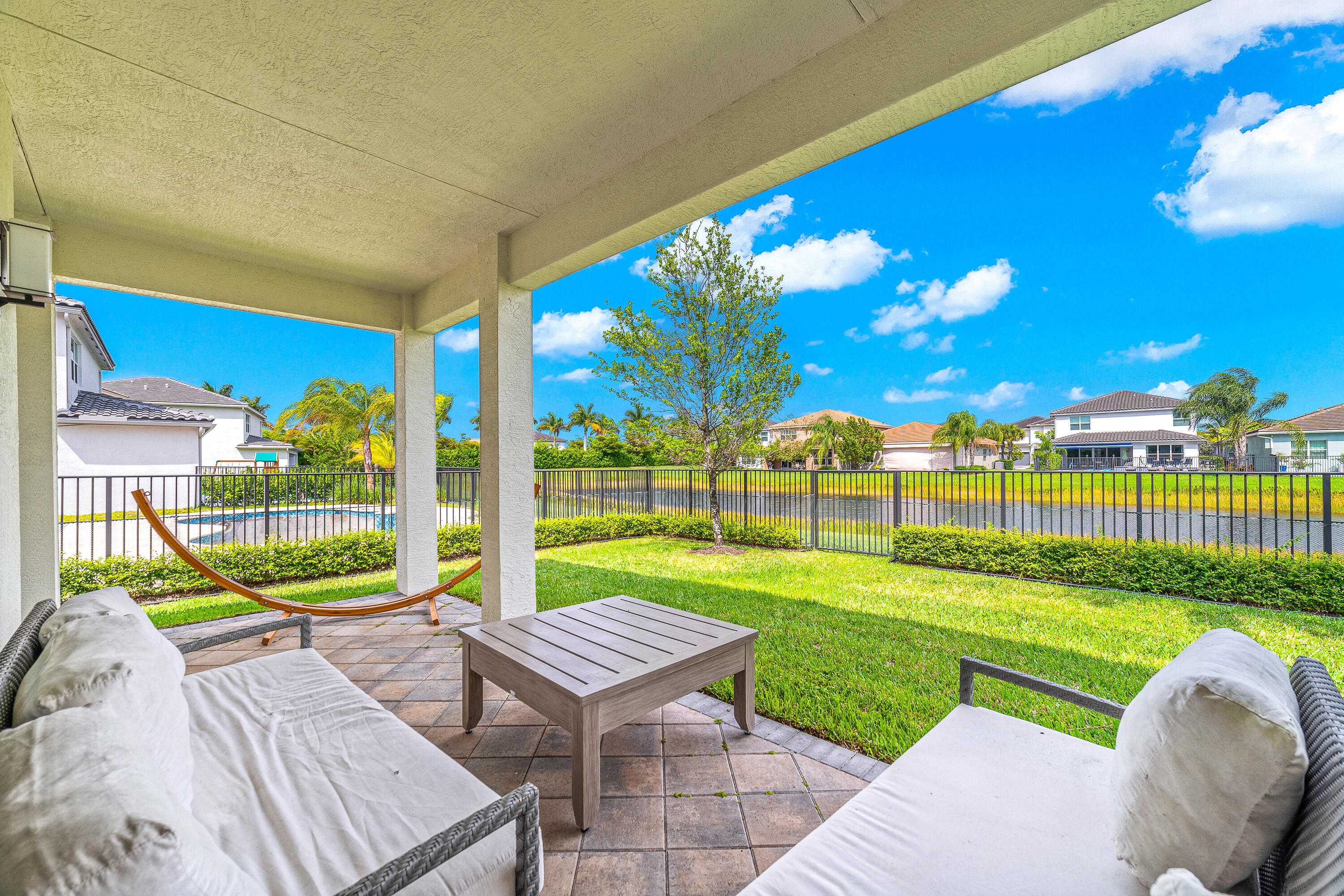 15380 Blue River Road Delray Beach, FL 33446 - Photo 22 of 31 a view of a backyard with a garden and plants