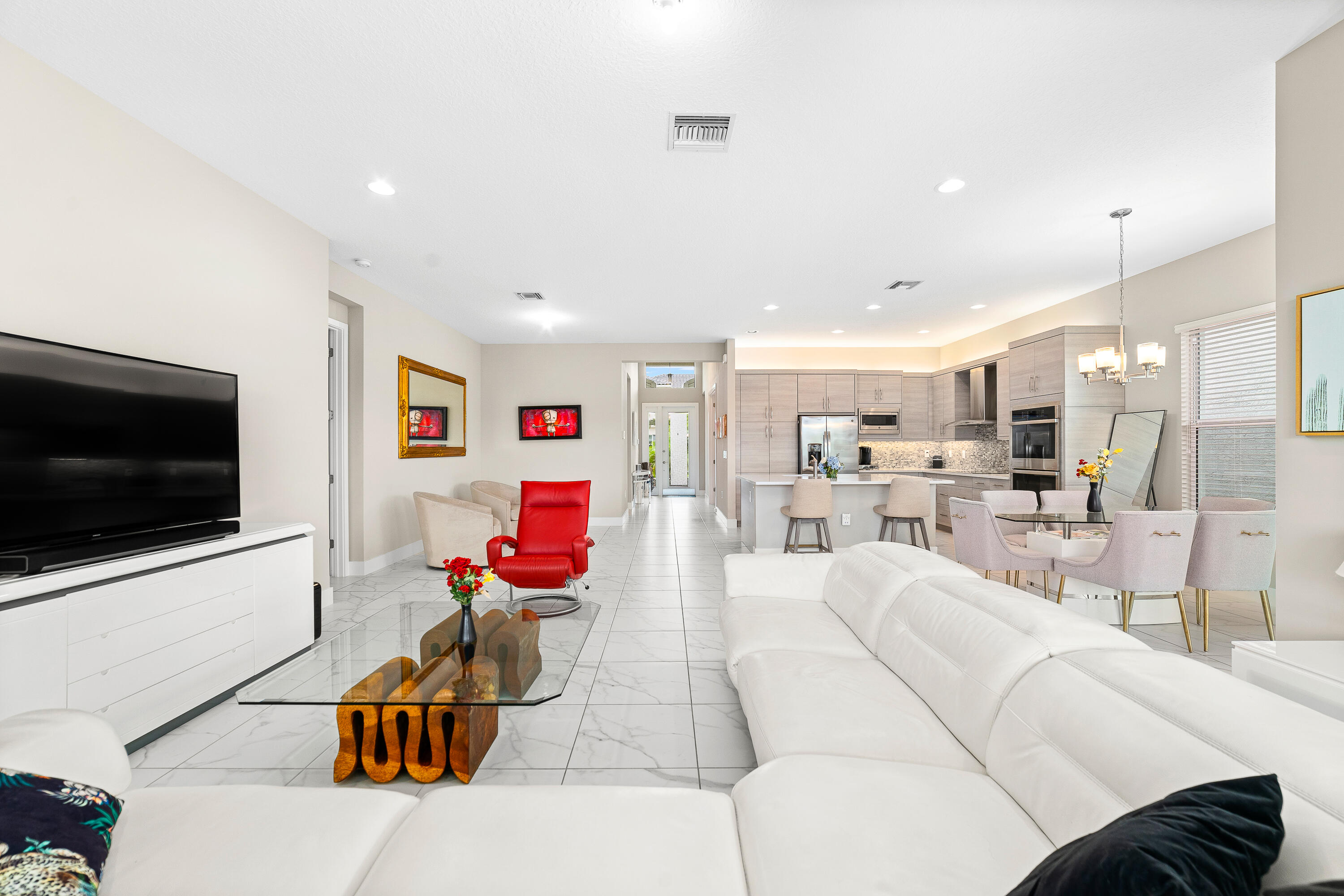 15380 Blue River Road Delray Beach, FL 33446 - Photo 5 of 31 a living room with furniture and a flat screen tv