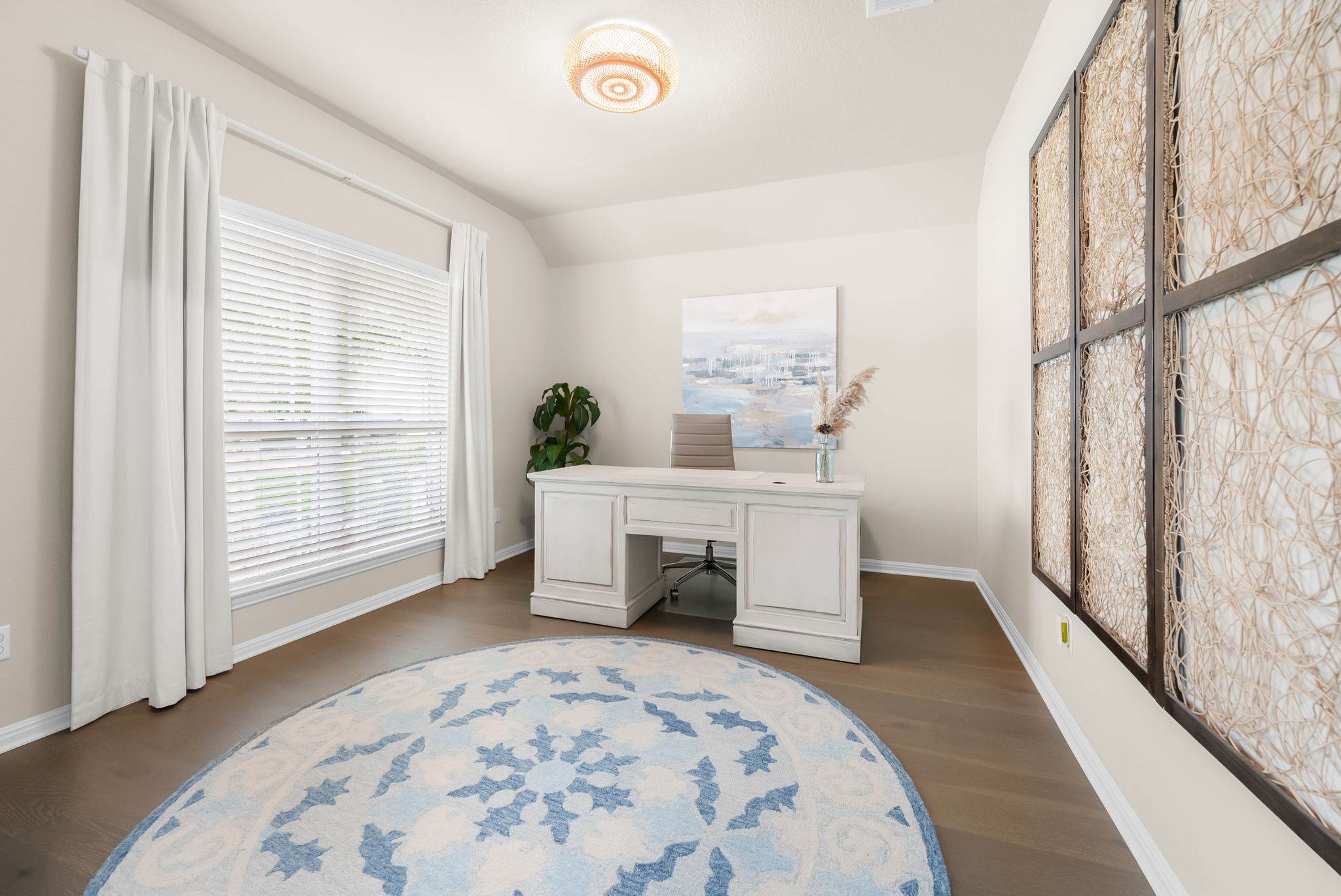 300 Prato Place Georgetown, TX 78628 - Photo 22 of 40 A well-appointed office space boasts ample natural light and rich wood flooring.