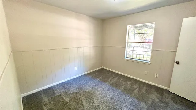 a bathroom with a toilet and bathtub